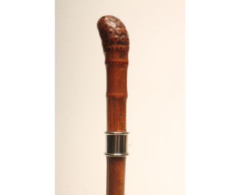 A BAMBOO SWORD STICK, early 20th century, with 29 1/4" square section tapering blade, white metal ferrule and grip inscribed 