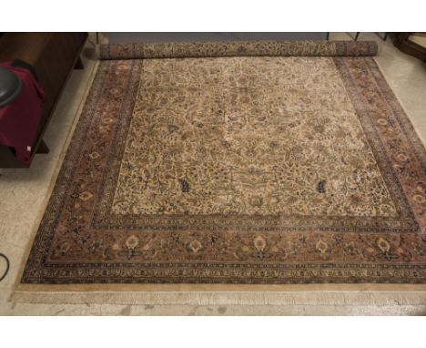 AN INDO PERSIAN ISFAHAN CARPET, the ivory field with all-over scrolling foliage and flowerheads in navy blue, sky blue, pink 