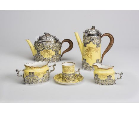 A CROWN STAFFORDSHIRE "EGGSHELL" CHINA AND SILVER FOUR PIECE TEA AND COFFEE SET, maker William Comyns, London 1894, the yello