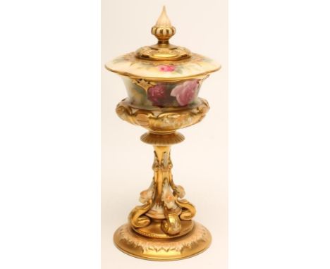 A ROYAL WORCESTER CHINA HIGH PEDESTAL POT POURRI AND COVER, 1928, of lobed baluster form with bead and strapwork moulded lowe