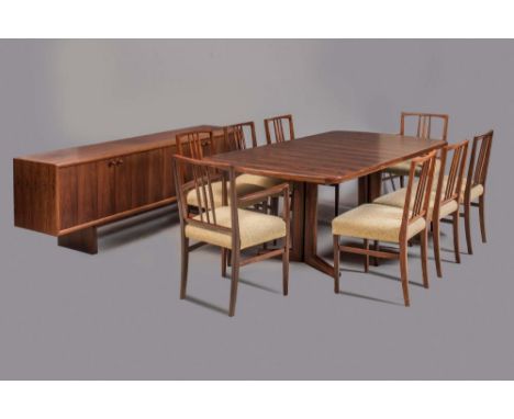 A GORDON RUSSELL "BRAZILIAN" ROSEWOOD DINING SUITE comprising rounded oblong extending Marlow dining table with a separate le