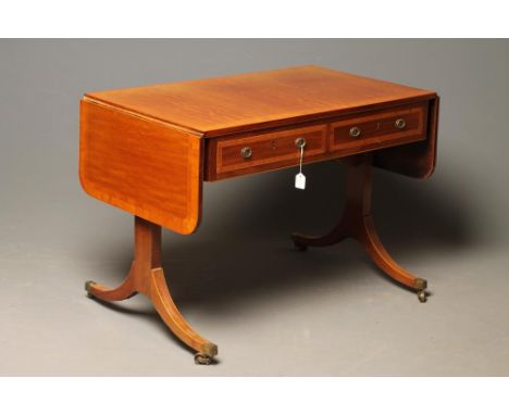 A GEORGIAN MAHOGANY SOFA TABLE, c.1800, crossbanded with stringing, the banded rounded oblong top over two frieze drawers wit