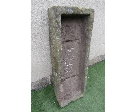 A SANDSTONE TROUGH of rough hewn oblong form, well cut, 46" x 16" x 8 1/2" (Est. plus 21% premium inc. VAT)