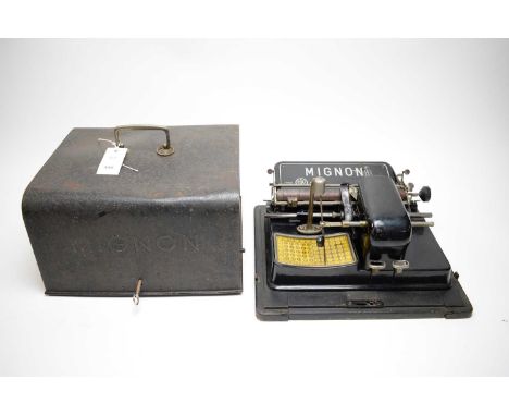A Mignon index typewriter, by AEG Berlin, in cast metal case, 33cms wide.