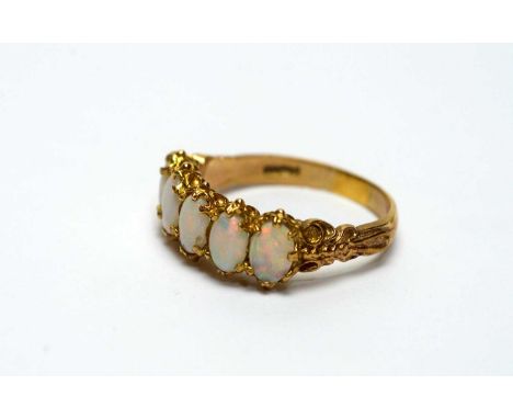 An opal ring, set with five oval opal cabochons, in 9ct yellow gold mount and shank, ring size Q, 3.7g gross. 