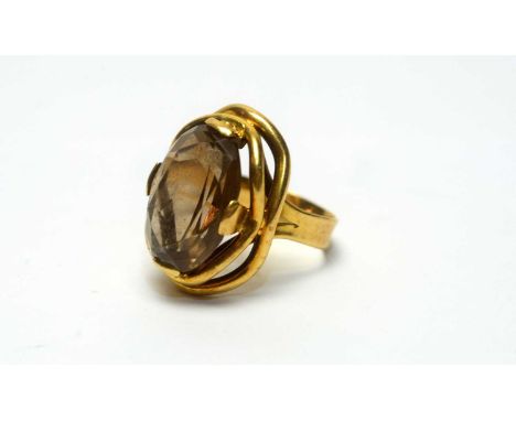 A smokey quartz ring, in 18ct yellow gold mount and shank, ring size M, 8.0g gross.