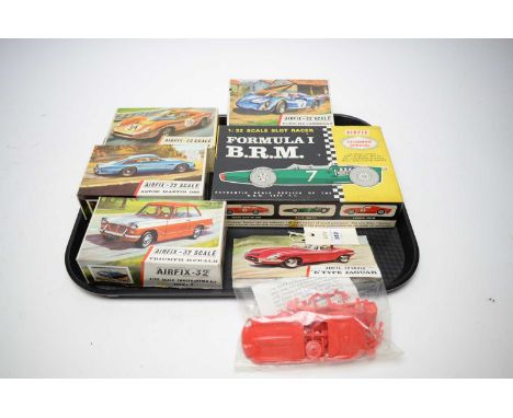 An Airfix-32 Scale ‘E’ Type Jaguar, in wrapper; together with an Airfix Forumla I B.R.M. Clubman Special scale slot racer kit