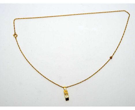 A diamond pendant, the princess cut diamonds in 18ct yellow gold mount, on 9ct yellow gold fine twist link chain. 