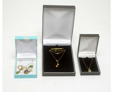 A garnet pendant, on 9ct yellow gold mount on chain, 4.3g gross; a pair of earrings, set with green stones in 9ct gold; a 9ct