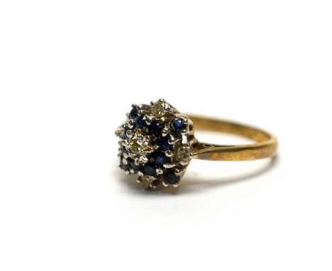 A sapphire and diamond cluster ring, on 9ct yellow gold mount and shank, ring size N, 2.6g gross. 