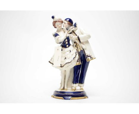 A Royal Dux Vienna ceramic figure group of a couple, 30cms high. 