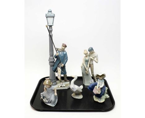 A Lladro ‘Lamplighter’ figure, 48cms high; together with various other figures, including: a Nao figure of a girl with a pupp