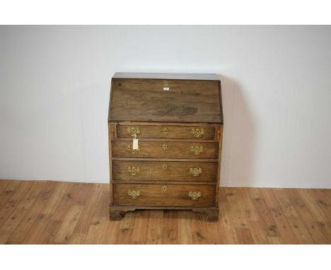 A 19th Century mahogany bureau of small proportions, the fall-front writing area opening to reveal a fully appointed interior