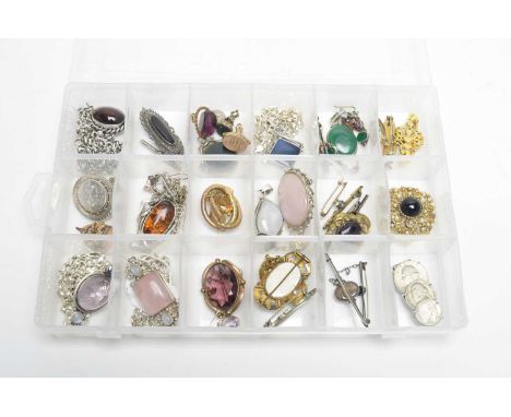 A collection of pendants, brooches and fobs, including: turquoise and seed pearl horse-shoe motif brooch; an amber pendant on
