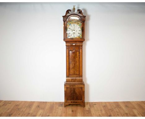 A 19th Century Scottish mahogany Grandfather/longcase clock, brass finial flanked by a scrolled pediment, painted roman dial 