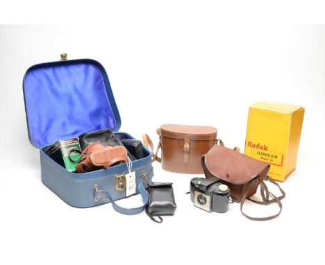 A selection of vintage cameras and accessories, including: Kodak Brownie 127 camera; Kodak Bantam Colorsnap camera; Kodak Adv