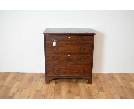 A 19th Century Georgian mahogany chest of drawers, the flared moulded edge over four graduated drawers with swan neck handles