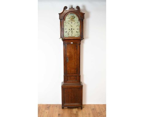 A 19th Century Victorian oak longcase/grandfather clock, the scrolled pediment above polychrome florally painted roman dial, 