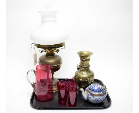 A vintage 20th Century gas oil lamp with pearlescent shade, 54cm high; together with a set of 20th Century cranberry glass be