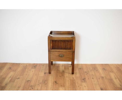 A 19th Century mahogany tray top commode/bedside table, with a single tambour fronted cabinet opening to reveal a spacious in