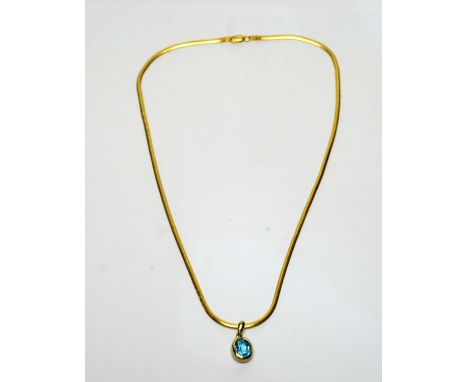 A topaz pendant, the oval facet cut blue topaz in 9ct yellow gold mount, on 9ct yellow gold snake link chain, 8.8g gross.