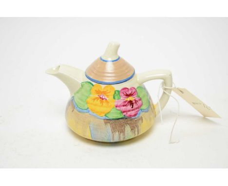 A Clarice Cliff ‘Bizarre’ Newport Pottery teapot, with colourful floral painted decoration and angular handle, 12cms high.