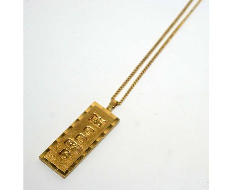 A 9ct yellow gold ingot pendant, on 9ct yellow gold chain, 34.7g gross. 