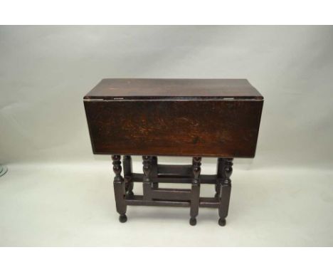 A PART 18TH CENTURY OAK SMALL DROPLEAF, the frame with ring turnings, later drop leaf top, 73cm x 81cm extended 