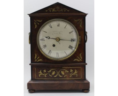 A 19TH CENTURY REGENCY MAHOGANY BRACKET TIMEPIECE, brass inlaid decoration, brass ring side handles, white enamel dial with R