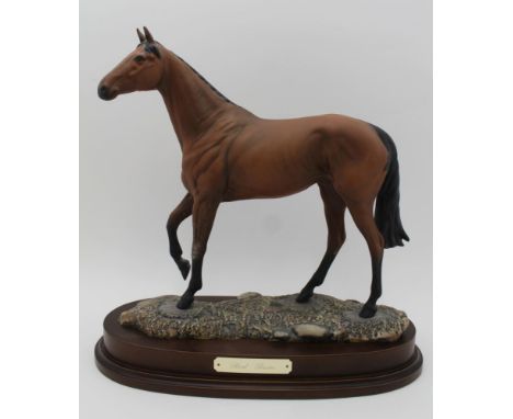 A ROYAL DOULTON CERAMIC MODEL OF 'RED RUM' modelled by J.G.Tongue, Ltd edition No.843 of 7,500 raised on a polished wood base