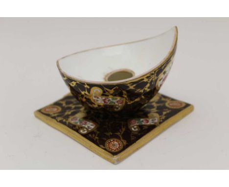 A WEDGWOOD CERAMIC INKWELL, gilded and painted on a noir ground, 6.5cm highCondition report: gilt wear overall.  Some black s