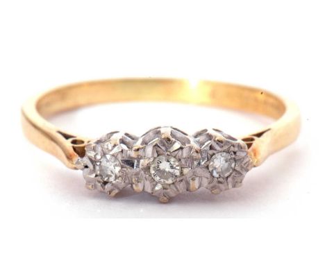 A three stone small diamond ring featuring round single cut diamonds in illusion settings, hallmarked for 18ct gold Birmingha