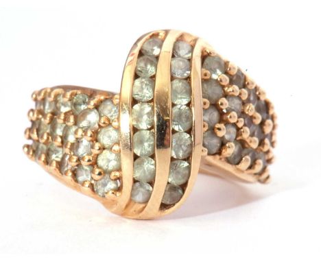 Modern 10k stamped ring, a stylised design set throughout with small light green coloured stones, g/w 6.6gms, size M/N