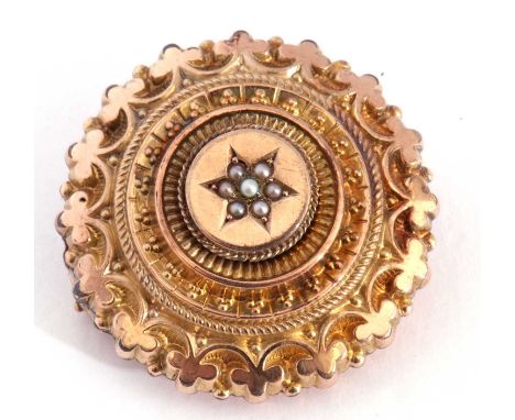 Victorian gold filled target brooch centring a seed pearl cluster, the verso with a glazed hair panel, 30mm diam