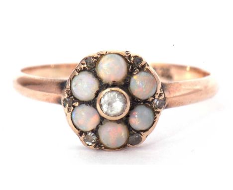 9ct gold opal, paste and diamond set cluster ring, the centre with a small paste set stone, surrounded by six round cabochon 