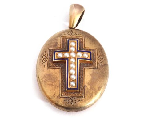 Victorian oval gold hinged locket, the centre applied with an enamel and seed pearl cross and engraved detailing, the verso a