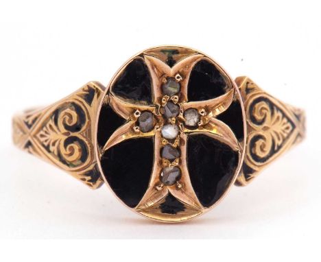 Victorian black enamel and diamond set mourning ring, the oval panel engraved with a central cross highlighted with seven sma