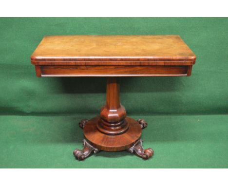 Rosewood card table with rounded corners and blue baize on outward tapering bulbous column leading to circular base, standing