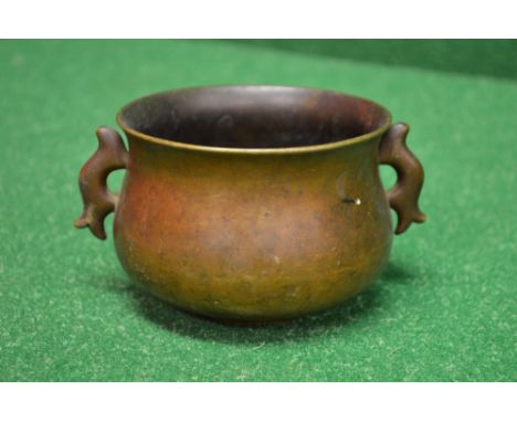 Bronze two handled censor having signature on base