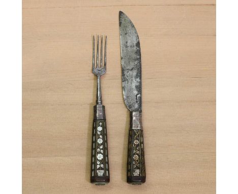A steel knife and fork,18th century, possibly Dutch East Indies, both with engraved date 'ANNO 1765', the handles inlaid with