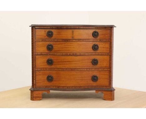 A George III-style inlaid satinwood miniature chest of drawers,20th century, in the Georgian style, the serpentine top and si
