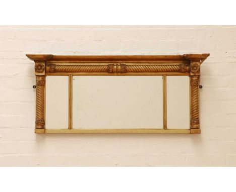 A small George IV gilt overmantel mirror,the moulded frame set with rosettes and rope twist mouldings around a triple plate,1