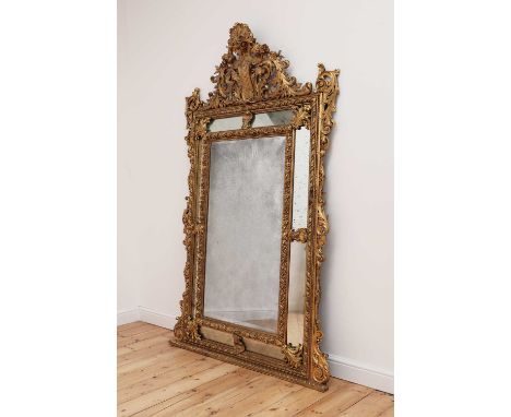 A large Dutch-style gilt-framed wall mirror,20th century, in the neoclassical manner, with profusely carved acanthus leaf and