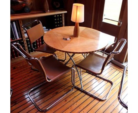 A maple veneer topped circular folding dining table, 1.06m diameter, together with a "Cadman" inlaid oak table lamp with crea