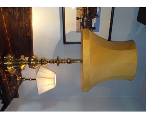 A large modern brass table lamp, 103cm high, together with two small brass table lamps on 18th century style tripod bases, 41
