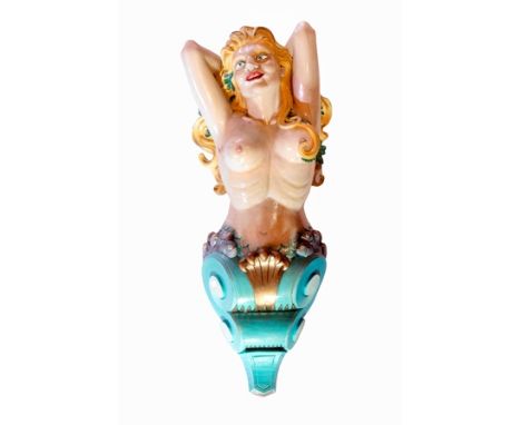 A 20th century carved wood and painted ship's figure head, in the form of a topless young woman with seaweed in her long blon