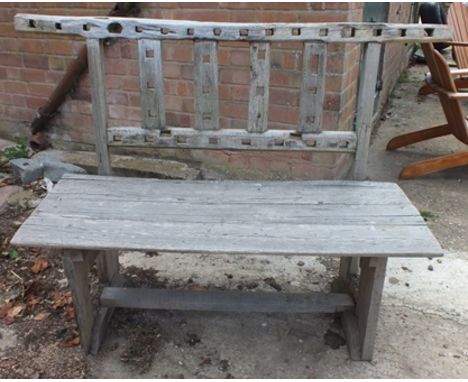 A rustic garden bench, the back frame and supports with geometric pierced decoration, plank seat, 1.2m wide, 97cm high 