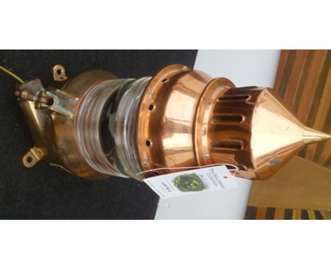 A gas accumulator lighthouse lantern of copper and brass construction, with glass shade. Bears engraved plaque "LBBZ 150 1308
