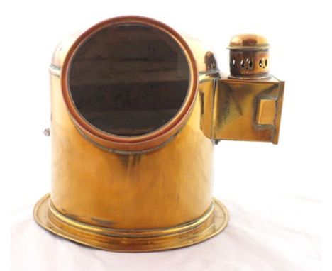 A brass binnacle cased ship's compass, circa 1900, the domed cover with ring carrying handle, side mounted oil lamp, complete