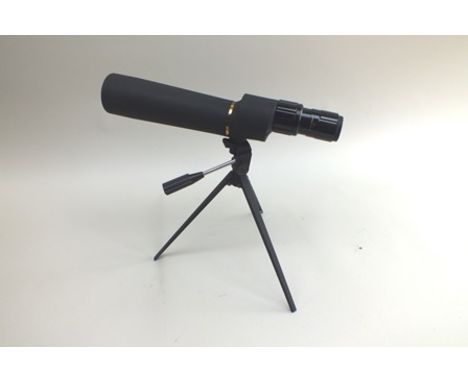 A "Bushnell" telescope 36 x zoom, with tripod, 35cm 